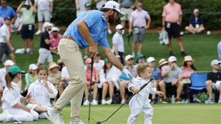 Cameron Young with his son Henry at the 2023 Masters tournament.