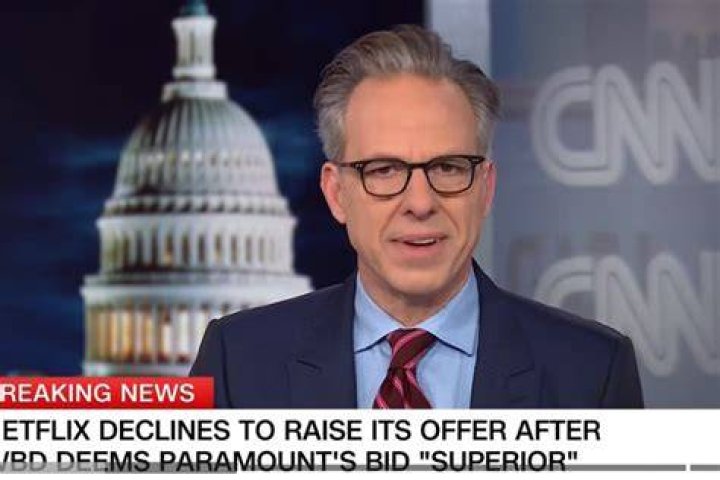 Jake Tapper presenting live news via CNN.
